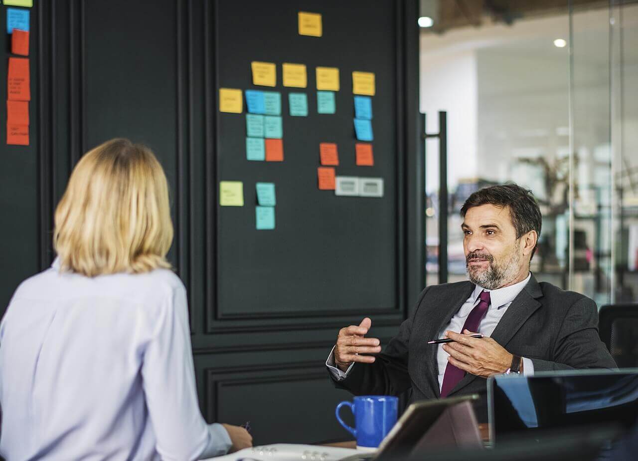 two people having a discussion in a meeting