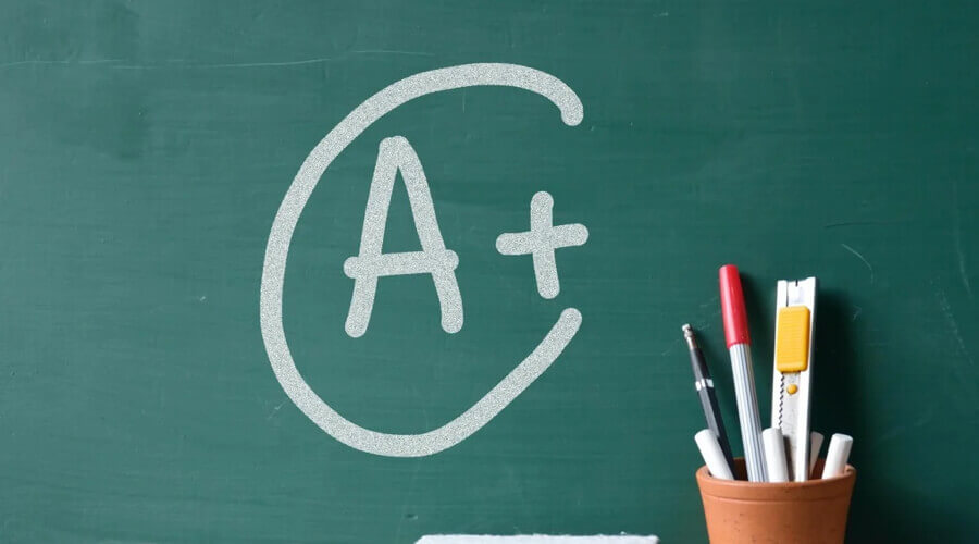 Chalkboard with an A+ drawn on for an exam score